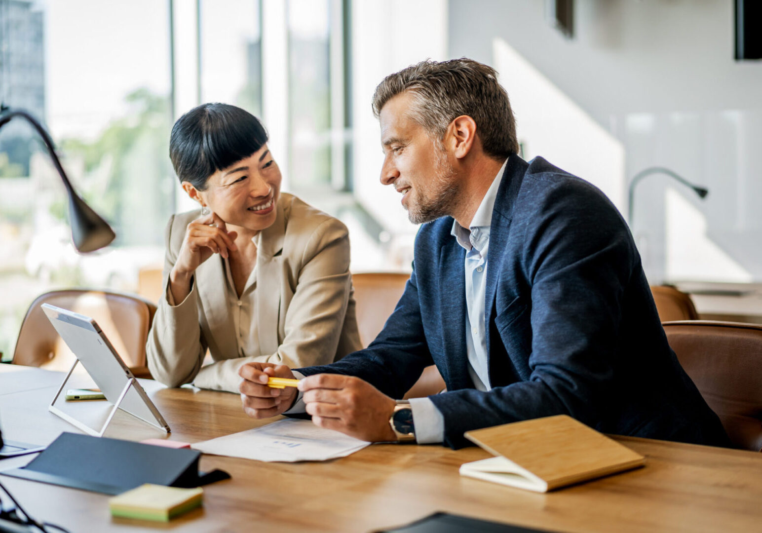 Two professionals collaborating in an office